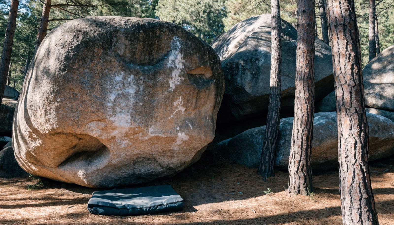 Granite boulders with a crash pad at the base